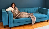 Testing the Oodie weighted blanket on the sofa