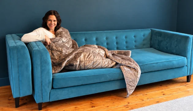 Testing the Oodie weighted blanket on the sofa