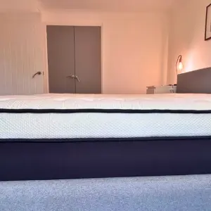 The Origin LumbarCloud Mattress from the side to show its layers and construction