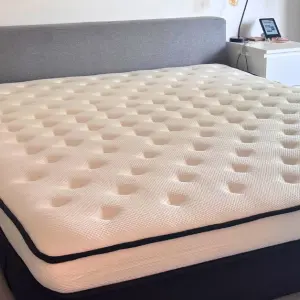 A view of the Origin LumbarCloud Mattress after its expanded fully and ready to have bedding added