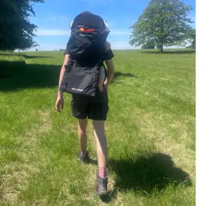Dad walking with Out n About Nipper Trek Baby carrier backpack