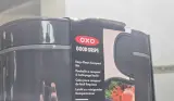 A close up of the packaging of the OXO Good Grips Easy-Clean Compost Bin