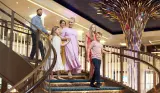 P&O Cruises family coming down stairs on ship
