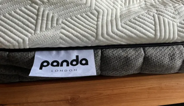 Close-up of the Panda Hybrid Bamboo Mattress, showing its white textured cover, grey side panel and Panda London label