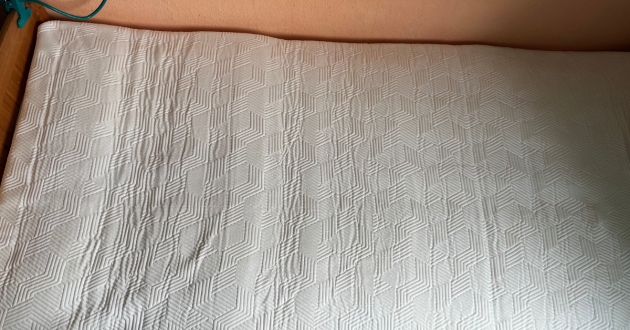 Top view of the fully expanded Panda Hybrid Bamboo Mattress with its white geometric-patterned cover