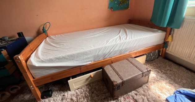 Panda Hybrid Bamboo Mattress on a wooden single bed in a teenager's bedroom, covered with a fitted sheet
