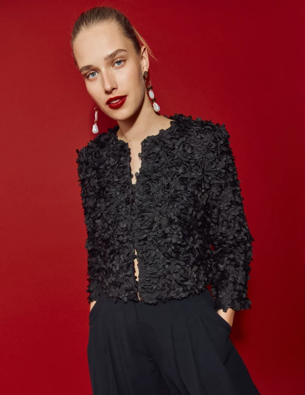 A model wears Boden's Petal Textured Cropped Jacket