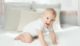 smiling baby crawling