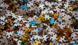 Scattered jigsaw puzzle pieces