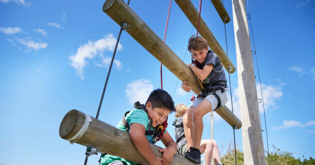 Kids climbing on a PGL Kids’ Adventure Camp