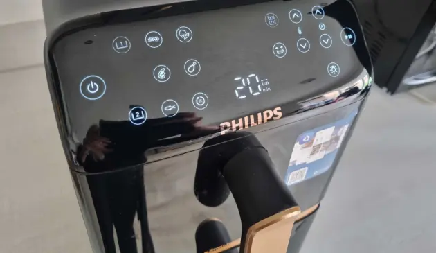 A close up of the control panel on the Philips 4000 Series NA462/79 Stacked Dual Basket Air Fryer
