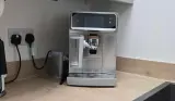 A view of the Philips Café Aromis Series 8000 newly unboxed on a kitchen counter