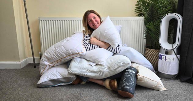 Rebecca Roberts surrounded by pillows tested by Mumsnet HQ