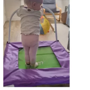 Toddler standing on Plum Play Junior Bouncer