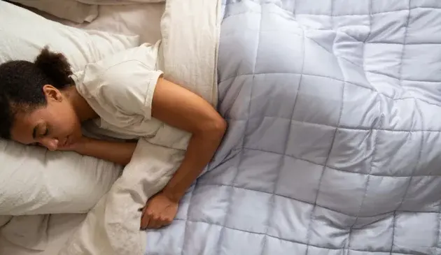 A woman sound asleep in bed