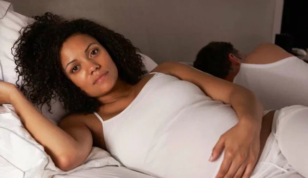 Pregnant woman trying to sleep