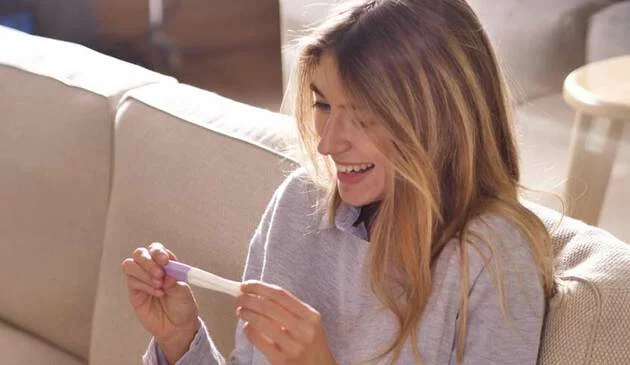 Woman taking a pregnancy test