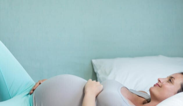 Pregnant woman lying down