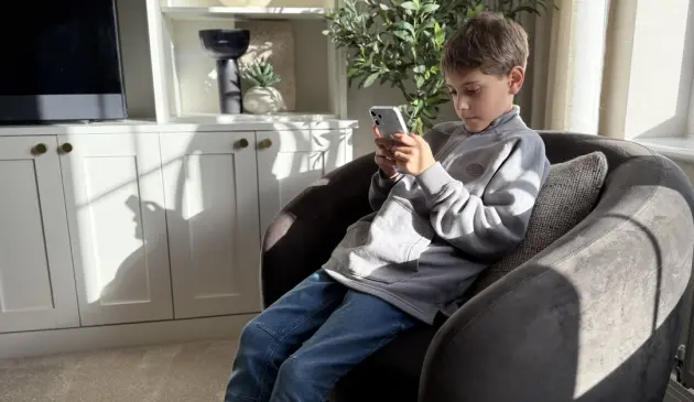 9 Year old Harrison tries the Other Phone