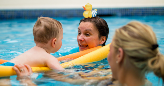 A child learning how to swim on a Puddle Ducks swimming lesson