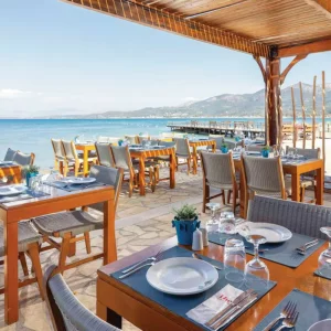 Restaurant overlooking the sea at Roda Beach Resort in Corfu