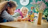 Two children happily building Disney's Up LEGO set
