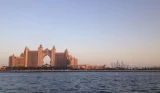 A view of Atlantis and the Dubai Marina skyline from a Dubai water taxi at dusk