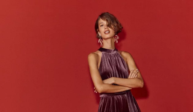 A model wears Boden's halterneck velvet jumpsuit