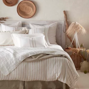 Secret Linen Store French Ticking Stripe Natural bedding set on a double bed in a cosy striped bedroom