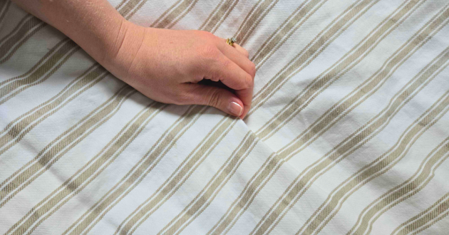 A close up of the stripes on the Secret Linen Store French Ticking Stripe Natural bedding set