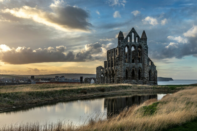 A front view of Whitby Abbey, Whitby, North Yorkshire with clouds in the sky
