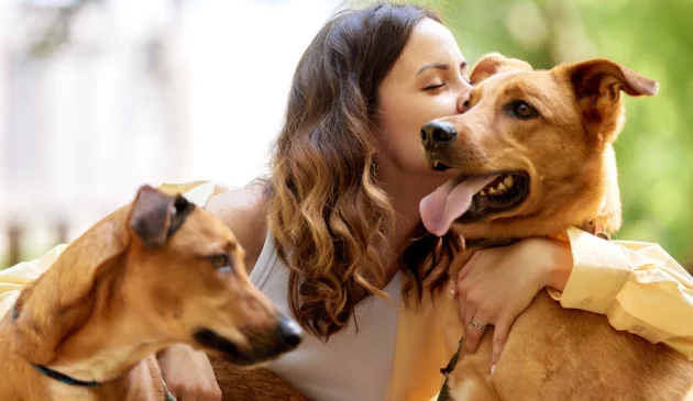 woman hugging dog