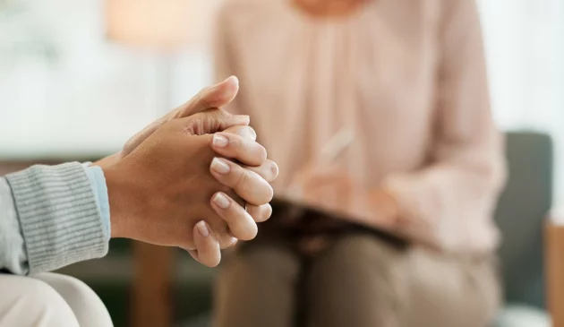 Woman discussing stopping GLP-1 weight loss injections with a doctor in the UK