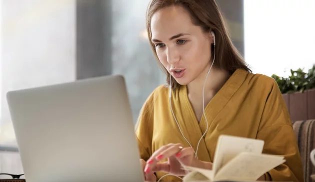 A teenager on a laptop studying
