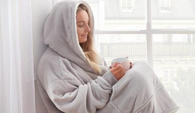 Woman wearing a blanket hoodie