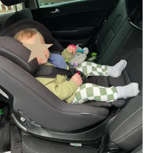 Baby in Silver Cross Approach Plus 360 car seat