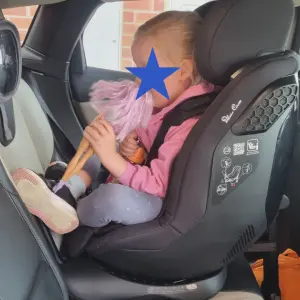 Child sitting in Silver Cross Perform car seat