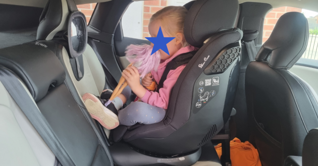 Child sitting in Silver Cross Perform car seat