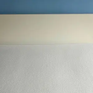 Simba Hybrid Essential Mattress photographed on a white bed frame before bedding was added