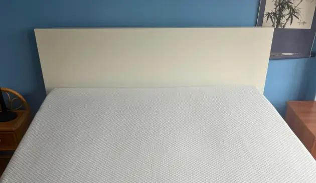 Simba Hybrid Essential Mattress photographed on a white bed frame before bedding was added