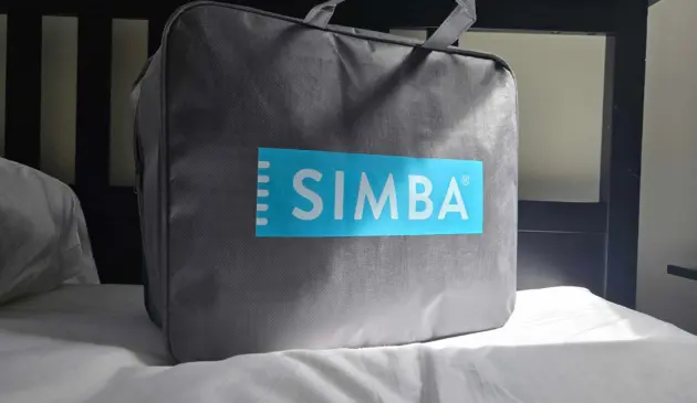 Simba's Summer Hybrid Duvet in its packaging a top a bed