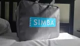 Simba's Summer Hybrid Duvet in its packaging a top a bed