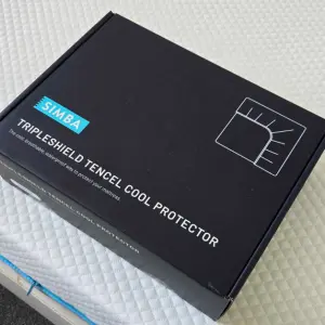 The box of the Simba TripleShield Tencel Cool Mattress Protector