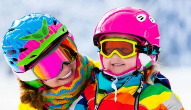 Mother and child skiing