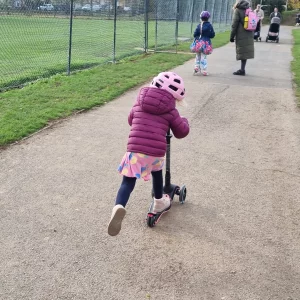Child riding smarTrike Xtend Ride-On Plus Scooter