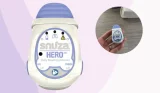 Snuza Hero MD baby breathing monitor review image showing stock image of monitor and monitor in testing