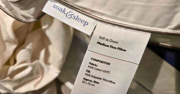A close up of the Soak & Sleep soft as down pillow label