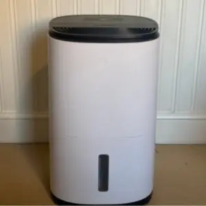 Mumsnet editor Poppy O'Neill hand testing the MeacoDry Arete® One 12L Dual Dehumidifier & HEPA Air Purifier
