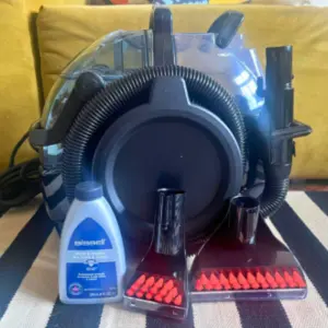 Mumsnet home editor Poppy O'Neill testing the Bissell SpotClean Pro Spot Carpet Cleaner
