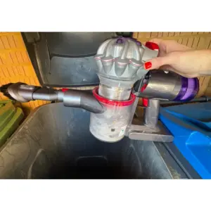 Mumsnet editor Rachel Erdos testing the Dyson Car+Boat Handheld Vacuum Cleaner